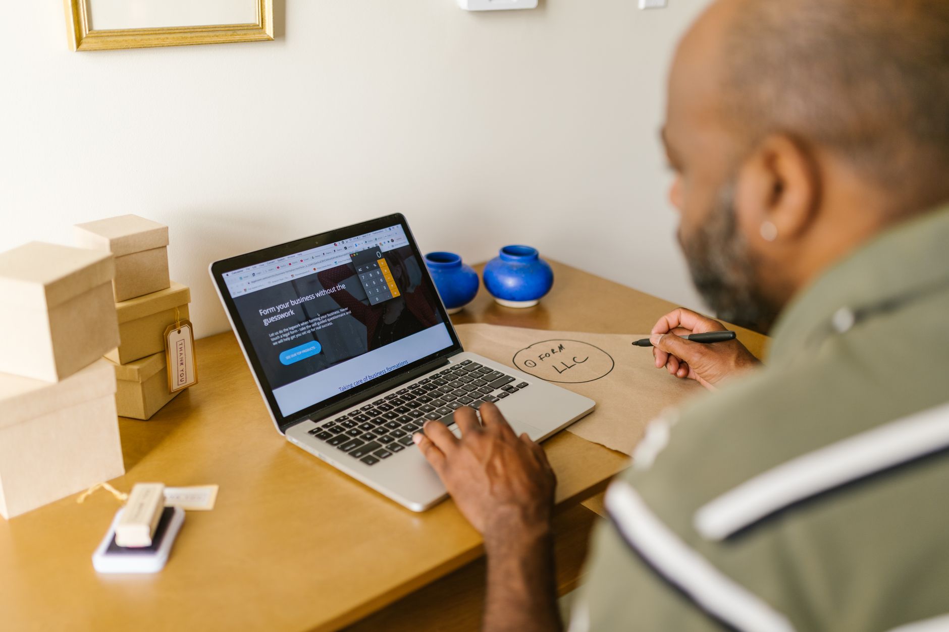 Small business owner working on a laptop